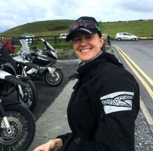 Picture of Deanna Deveau, The Happy Canuck at the Cliffs of Moher in Ireland.