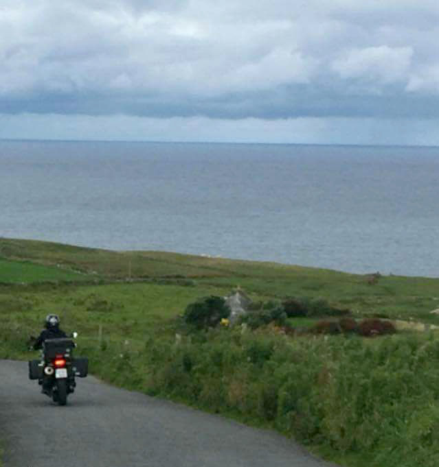 Picture of Deanna Deveau, The Happy Canuck on her motorbike in Ireland.